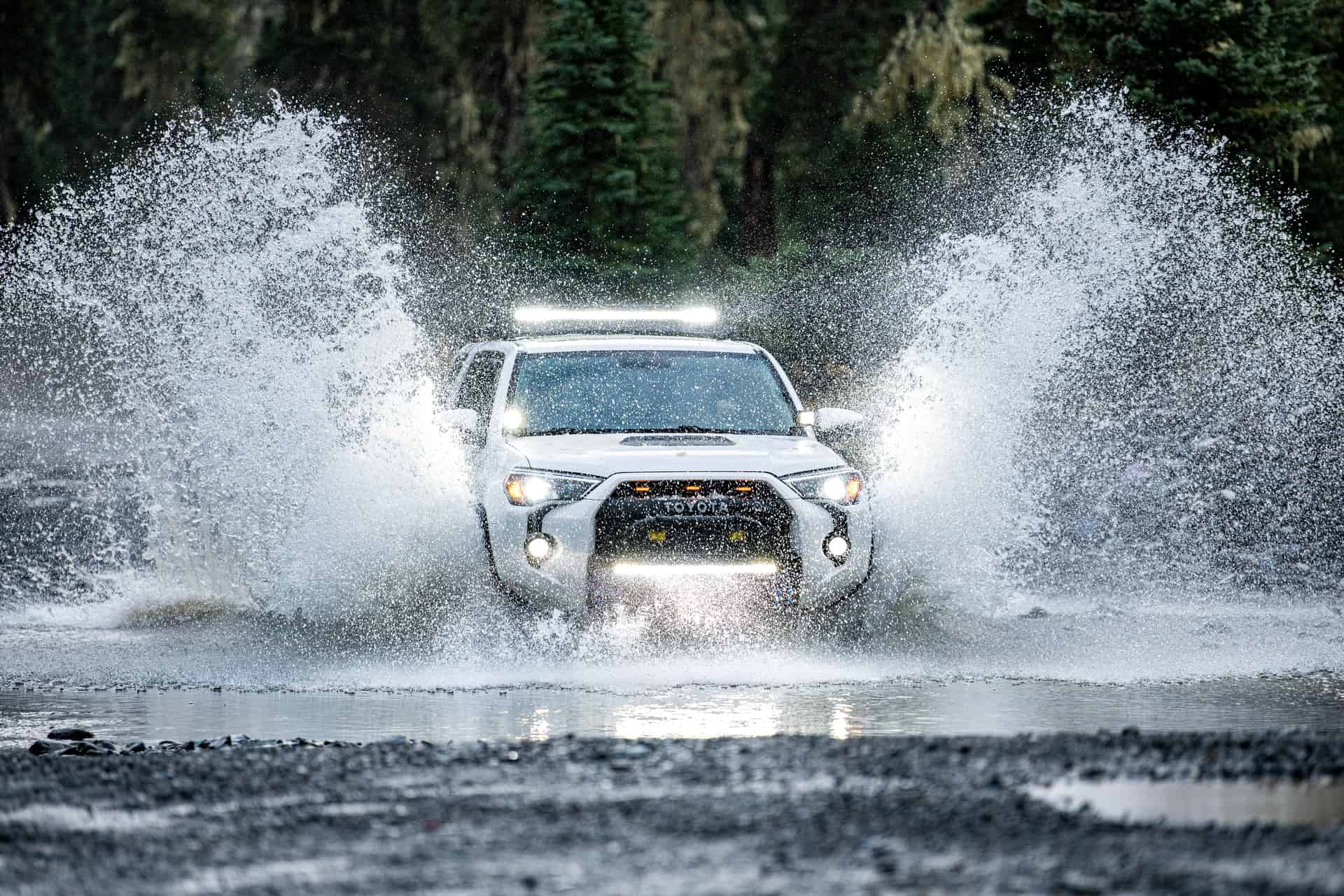 toyota 4runner running across the creek